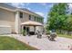 Inviting backyard with a charming patio, fire pit, and lush landscaping, perfect for outdoor relaxation and entertaining at 4001 Brook Valley Run, Monroe, NC 28110