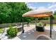 Cozy backyard patio featuring comfortable seating, lush greenery, and a peaceful ambiance, ideal for relaxation at 4001 Brook Valley Run, Monroe, NC 28110