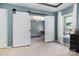 Stylish bedroom featuring barn door, natural light, and a view to the outside at 4001 Brook Valley Run, Monroe, NC 28110
