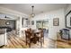 Charming breakfast nook with hardwood floors, a round table, and sliding glass doors to the backyard at 4001 Brook Valley Run, Monroe, NC 28110