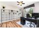 Well-lit office with a large window, modern desk, and extensive built-in shelving for storage at 4001 Brook Valley Run, Monroe, NC 28110