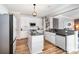 Modern kitchen featuring white cabinets, granite countertops, stainless steel appliances, and an island at 4001 Brook Valley Run, Monroe, NC 28110