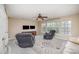Comfortable living room featuring neutral walls, large windows, plush seating, and a contemporary ceiling fan at 4001 Brook Valley Run, Monroe, NC 28110