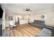 Spacious living room featuring hardwood floors, an open layout, and a view into the kitchen at 4001 Brook Valley Run, Monroe, NC 28110