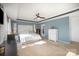 Bright main bedroom offering a tray ceiling, ceiling fan, and plush carpet, providing ultimate comfort at 4001 Brook Valley Run, Monroe, NC 28110