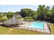 Inviting community pool with ample lounge chairs, surrounded by mature trees and well-maintained landscaping at 4001 Brook Valley Run, Monroe, NC 28110