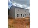 Picture of the back of a home with large windows and a door leading to the backyard, all set on a spacious lot at 436 Phifer Rd, Kings Mountain, NC 28086