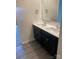 Stylish bathroom boasts a double vanity with sleek black cabinets, modern chrome faucets, and a large mirror at 436 Phifer Rd, Kings Mountain, NC 28086
