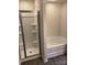 Well-lit bathroom featuring a glass-door shower with chrome fixtures, and a separate soaking tub for relaxation at 436 Phifer Rd, Kings Mountain, NC 28086
