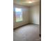 Bright, carpeted bedroom featuring a window that offers natural light and neighborhood views at 436 Phifer Rd, Kings Mountain, NC 28086