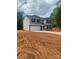 Charming two-story home with blue shutters, a two-car garage and unfinished landscaping at 436 Phifer Rd, Kings Mountain, NC 28086