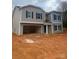 Charming two-story home featuring a welcoming facade and an attached two car garage awaiting customization at 436 Phifer Rd, Kings Mountain, NC 28086
