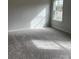 Bright and airy bedroom features neutral carpet and a sunny window at 438 Phifer Rd, Kings Mountain, NC 28086