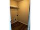 Empty walk-in closet with wood-look floors and shelving, ready to be organized and filled with items at 438 Phifer Rd, Kings Mountain, NC 28086