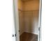 Cozy walk-in closet with a single metal rack and carpeting at 438 Phifer Rd, Kings Mountain, NC 28086