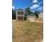 Charming two-story home with a light beige exterior, brick-red shutters and a two-car garage at 438 Phifer Rd, Kings Mountain, NC 28086