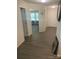 Inviting hallway with wood-look flooring and neutral walls, leading to various rooms in the home at 438 Phifer Rd, Kings Mountain, NC 28086