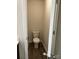 Efficient powder room with a toilet and vinyl flooring at 438 Phifer Rd, Kings Mountain, NC 28086