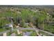 An aerial view of the property showcasing a wooded area with single Gathering home at 4896 Birch Cir, Hickory, NC 28602