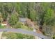 An aerial view of the property showcasing a wooded area with single Gathering home at 4896 Birch Cir, Hickory, NC 28602