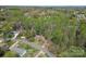 An aerial view of the property showcasing a wooded area with single Gathering home at 4896 Birch Cir, Hickory, NC 28602