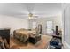 Neutral bedroom featuring a ceiling fan, a window, and a door to the outside at 4896 Birch Cir, Hickory, NC 28602