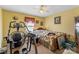 Comfortable bedroom featuring workout equipment, a window, and a ceiling fan at 4896 Birch Cir, Hickory, NC 28602