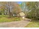Charming home with a covered porch, surrounded by mature trees and landscaping at 4896 Birch Cir, Hickory, NC 28602