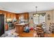 Eat-in kitchen featuring oak cabinets, laminate countertop, stainless steel appliances, and a dining area at 4896 Birch Cir, Hickory, NC 28602