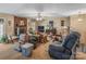 Inviting living room featuring a brick fireplace, neutral walls, and traditional furniture arrangement at 4896 Birch Cir, Hickory, NC 28602