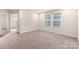 Spacious bedroom with neutral carpet and great natural lighting at 504 Cranford Dr, Pineville, NC 28134