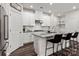 Modern kitchen with white cabinets, stainless steel appliances, granite countertops, and a convenient breakfast bar at 504 Cranford Dr, Pineville, NC 28134