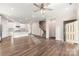 Bright living area open to the kitchen, showcasing hardwood floors and an airy, inviting atmosphere at 504 Cranford Dr, Pineville, NC 28134