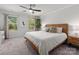 Stylish main bedroom with hardwood floors, bright windows, and contemporary furnishings at 504 Cranford Dr, Pineville, NC 28134