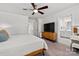 Cozy main bedroom with soft carpet, ceiling fan, and access to en-suite bathroom and walk-in closet at 504 Cranford Dr, Pineville, NC 28134
