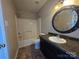 Bathroom with a sink and mirror at 5416 River Falls Dr, Charlotte, NC 28215
