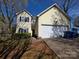 Charming two-story home with a two-car garage and well-maintained landscaping at 5416 River Falls Dr, Charlotte, NC 28215