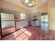 Updated kitchen with stainless steel appliances, gray cabinets, and lots of natural light at 5416 River Falls Dr, Charlotte, NC 28215