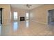 Spacious living room featuring a fireplace, tiled flooring, and large windows at 5416 River Falls Dr, Charlotte, NC 28215