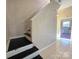 View of the carpeted staircase at 5416 River Falls Dr, Charlotte, NC 28215