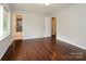 Spacious bedroom with hardwood floors, natural light, and ensuite bathroom for added convenience at 5601 Indian Brook Dr, Matthews, NC 28104