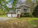 Charming two-story home with a two-car garage and inviting front porch at 5601 Indian Brook Dr, Matthews, NC 28104