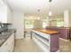 Open kitchen with a central island, stainless appliances, and modern fixtures at 5601 Indian Brook Dr, Matthews, NC 28104