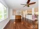 Spacious living room with hardwood floors, open to the kitchen area at 5601 Indian Brook Dr, Matthews, NC 28104