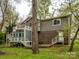 Charming home boasts a spacious deck, two stories, and a well-maintained backyard at 5601 Indian Brook Dr, Matthews, NC 28104