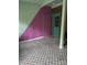 Unique room features a painted accent wall and patterned tile flooring, with two doors at 5601 Indian Brook Dr, Matthews, NC 28104