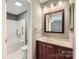 Bathroom with tile floors, and combined shower and tub at 5913 Crape Myrtle Ln, Charlotte, NC 28216
