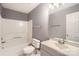 Clean bathroom with a shower-tub combo, neutral walls, and a modern vanity at 5913 Crape Myrtle Ln, Charlotte, NC 28216