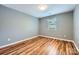 This room has new floors, neutral paint, and a nice-sized window at 5913 Crape Myrtle Ln, Charlotte, NC 28216