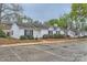 Charming single-story townhome with black shutters, neat landscaping, and convenient parking at 5913 Crape Myrtle Ln, Charlotte, NC 28216